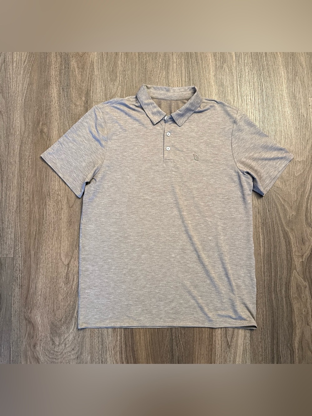 VUORI light brown heathered polo shirt with subtle textured pattern. MEDIUM.